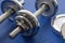 Dumbbells on blue yoga mat