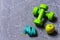 Dumbbells in green color, apple and cyan measuring tape