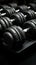 Dumbbells in varying weights, all in sleek black, perfect for versatile workouts