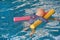 Dummy drowning training baby doll float in the pool with noodles