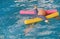 Dummy drowning training baby doll float in the pool with noodles