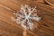 Dummy white snowflake on wood background