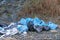 Dump garbage bags in nature near mountains environmental pollution.