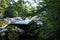 Dump of old disassembled cars in the forest.
