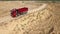 Dump truck driving on countryside. Scene. Top view of truck driving on quarry road in countryside on background of