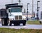 Dump Truck Leading Traffic On A Wet Winter Day