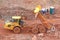 Dump truck tipping on a road construction site