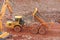 Dump truck tipping on a road construction site