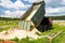 The dump truck unloads sand. The truck dumped the cargo. Sand and gravel. Construction site, materials warehouse.