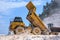 Dump truck working with excavator in Marble Quarry