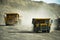 Dump trucks on a coal mine on a Sunny day