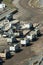 Dump trucks lined up at a rock quarry