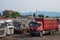 Dump trucks picking up scrap metal at recycling center in junk yard. Recycling industry. Environment and zero waste