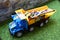 Dumper toy transporting multi colored wooden blocks