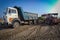 Dumper tyre stucked in sand during construction work