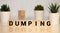 Dumping word written on wood block