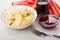 Dumpling in bowl, cherry syrup in bottle and bowl, fork