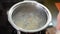 Dumplings are boiled in boiling water in a pan on an induction stove
