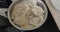 Dumplings are boiled in a saucepan in boiling water