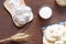 Dumplings, dough, ears of wheat and oats in a wooden bowl