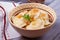 Dumplings, filled with mashed potato - vegetarian dish. Varenyky, vareniki, pierogi, pyrohy in a bowl on wooden table