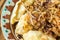 Dumplings with meat and onions. Selective focus. Close up fresh boiled dumplings with hot steams on wood plate. Chinese food on ru