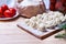 Dumplings with meat on a wooden stand - cooking, raw unpeeled dumplings, national Russian, Ukrainian cuisine