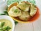 Dumplings parsley sauce traditional homemade napkin lunch on a white wooden background