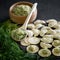 Dumplings with potatoes and dill. Product for eating or freezing, cooking process. Raw dough stuffed with mashed