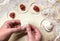 Dumplings raw and dough, traditional making of Russian pelmeni. Process of cooking ravioli, tortellini and pierogi with meat