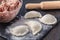 Dumplings raw on a wooden board. Traditional homemade food. The