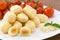 Dumplings stuffed with mozzarella and tomato sauce
