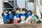 Dumpsters being full with garbage.  Overflowing garbage bins with household waste. overflowing blue garbage bin.