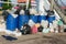 Dumpsters being full with garbage.  Overflowing garbage bins with household waste. overflowing blue garbage bin.