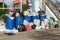 Dumpsters being full with garbage.  Overflowing garbage bins with household waste. overflowing blue garbage bin.