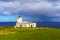 Duncansby Head Lighthouse, with a rainbow