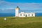 Duncansby Head lighthouse in a sunny day, Caithness, Scotland.