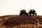 Dune Buggies being driven by tourists at aa Desert Safari park in the red sand dunes near Dubai