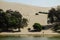 And dune buggies and tourists on sand dunes around Huacachina oasis at Ica, Peru