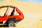 Dune buggy used to carry tourists practicing sand-boarding on the dunes in Huacachina desert, Peru