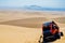 Dune buggy used to carry tourists practicing sand-boarding on the dunes in Huacachina desert, Peru