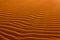 Dune in the desert, sculpted by the wind. Sand Texture.