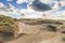 Dune landscape Dutch North Sea coast with slopes with dune grasses and bare valleys