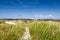 Dune landscape with lighthouse at North Sea