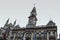 Dunedin, New Zealand - June 21, 2016: Dunedin Town Hall and St. Paul`s Cathedral at the Octagon in the city centre on a cloudy