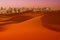 Dunes of Desert at dawn and skyscrapers of  Dubai United Arab Emirates