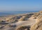 dunes and almost deserted beach on dutch coast near renesse in zeeland under blue sky