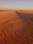 Dunes flow into the sky