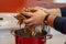 Dungeness crab legs are being put into a large boiling pot of water