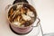 Dungeness crab legs are being put into a large boiling pot of water
